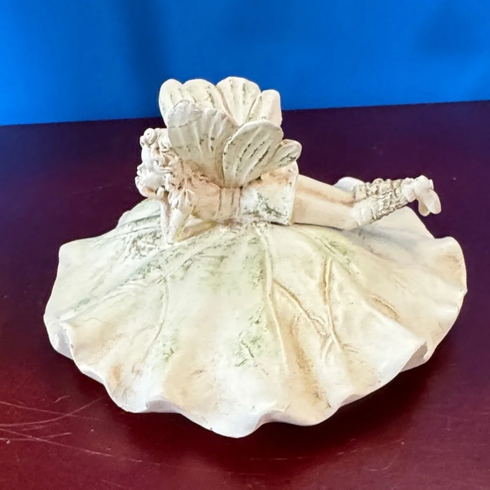 Vintage 1980 Avon Lily Fairy Daydreaming trinket or keepsake box.